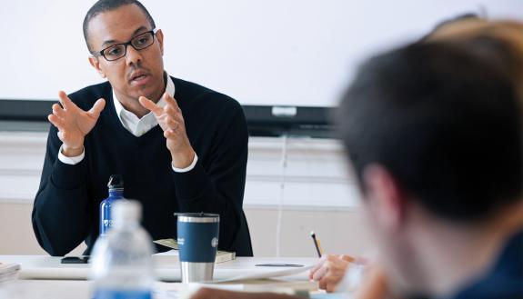 Man talking with co-workers.