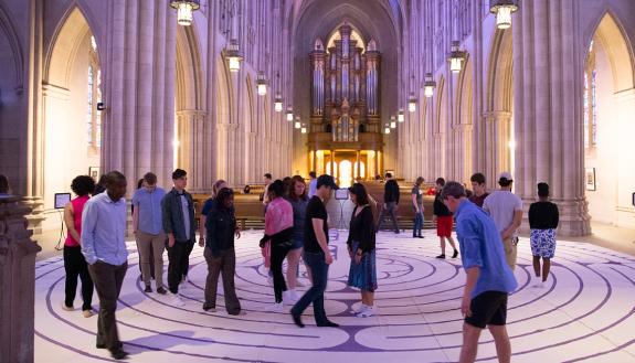 Duke community members take part in the labyrinth walk in the Duke Chapel. The self-guided walk is an ancient spiritual practice of meditation and self-centering found in religious traditions from around the world.