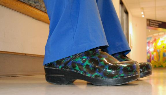 Maddie Morales, a nurse at Duke University Hospital, brings comfort and color to her day with choice of footwear. Photo by Stephen Schramm.