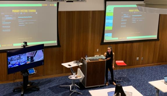 Minna Ng, assistant professor of the practice of Psychology and Neuroscience, teaches a class alongside a Zoom Cart. Photo by Yimin Wei.