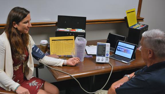 Muriel Canup, a human resources information specialist, has her blood pressure measured at a My Health screening.