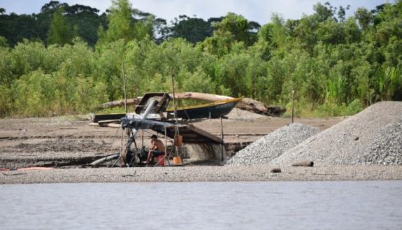 Small-scale, artisanal mining operations such as the one shown here cause deforestation, which in turn leads to erosion that exacerbates the release of mercury into the local watershed.