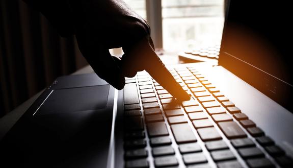Finger on a computer keyboard