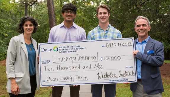 Aryan Kothari (center left) and Michael Wood III (center right) accepted the 2022 Clean Energy Prize on behalf of the Energy Terminal team. The prize was presented by Jamie Jones (left), director of Duke Innovation & Entrepreneurship, and Brian Murray 