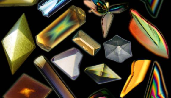 Not all protein crystals exhibit the colorful iridescence of these crystals grown in space. But no matter their looks, all are important to scientists. Credit: NASA Marshall Space Flight Center (NASA-MSFC).