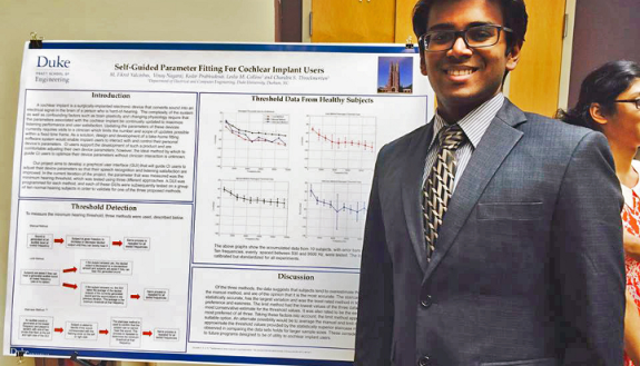 Vinay Nagaraj at a a Duke research fair where he presented his research about cochlear implants