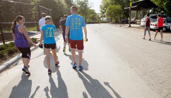 Duke employees walk together during a Run/Walk Club meetup.