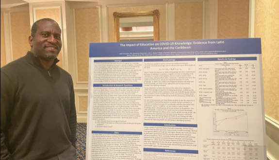 Dr. Colin Cannonier and his poster