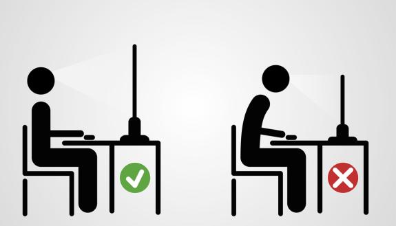 When seated, sit up straight so your ears, shoulders and hips are aligned.