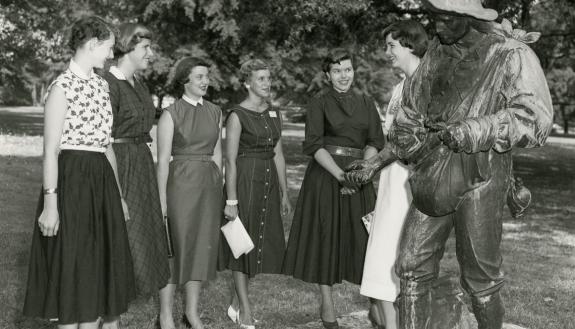 Duke students gather around The Sower on East Campus in 1954.