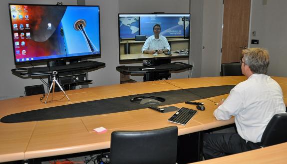 Eric Carter at Fuqua School of Business tests a teleconference session.