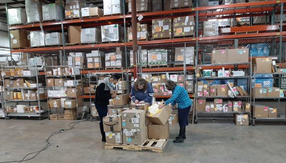 Left to right: Duke Procurement and Supply Chain Management team members Ajia Veras, Donna Neal and Tonya Oakley sort packages meant for Duke's campus. Photos courtesy of Mary Crawford.