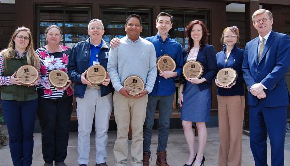 Duke Sustainability Award winners, from left to right, Belle Farish, Susan Jackson, Charlie Perez, Abhi Bathula, John Desan, Trisha Dupnock, Amanda Starling Gould and Duke University President Vincent E. Price. Photo by Stephen Schramm.