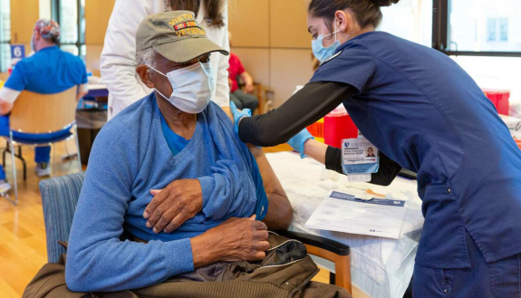 A man receives a COVID-19 vaccine.