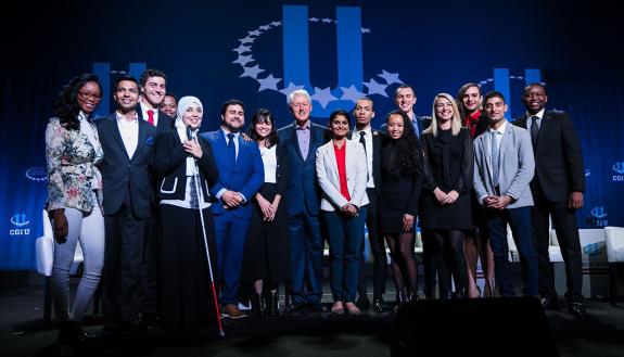 Fifteen CGI U Honor Roll individuals join Bill Clinton on stage. Three were alums from Duke. One is a recent Duke alumnus who already has helped make progress for the LGBTQ community across the nation. One is helping to break the glass ceiling for women i