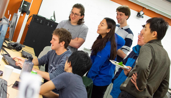 Some of Duke's Global Game Jam participants check out each other's work after two days of development.