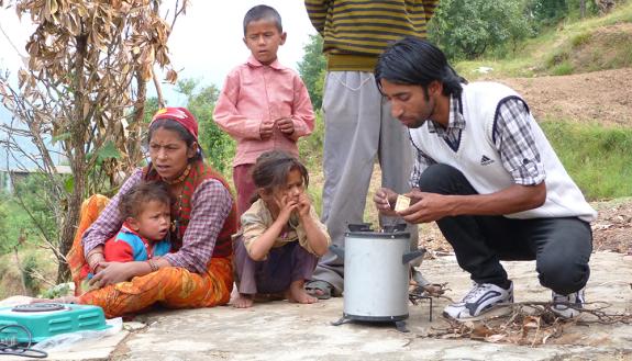 A family in rural India tries using a new cookstove.