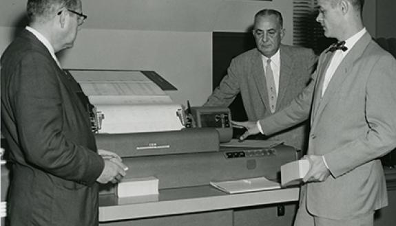 From left, G.C. Henricksen, A.S. Brower, and Kenneth Manning pose by an IBM computer in 1954. The technology wasn't what we're used to today, but could be used for tasks such as math equations. Photo courtesy of University Archives.
