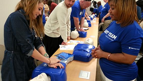 In December, 261 Duke employees took free compression-only CPR classes at the Duke Medicine Pavilion. The training included practicing compressions on a manikin. Photo by April Dudash