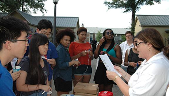 Karen Goddard and Traci Scoggins, alumni of the Duke Citizens' Police Academy, provide a safety questionnaire to students during last year's National Night Out on Duke campus. Photo courtesy of Duke Police