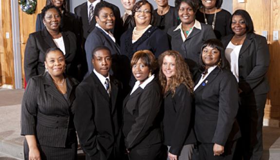 Rodney Coffin, second from left in the back row, was among the 2011 graduating class of the PDI Office Staff Development Class. Photo by University Photography.
