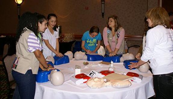 The Duke Heart Center holds compression-only CPR training at Duke and in the community. This CPR training in the photo was held in 2012 at the Embassy Suites in Cary. Photo courtesy of the Duke Heart Center