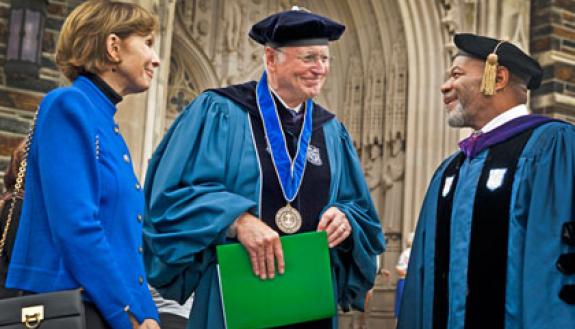 A scene from the 2011 Founders' Day: Karl von der Heyden, who also received the University Medal and gave the Founders' Day address, and his wife Mary Ellen talks with Divinity Professor William Turner following the ceremony. Photo: Duke University Photo