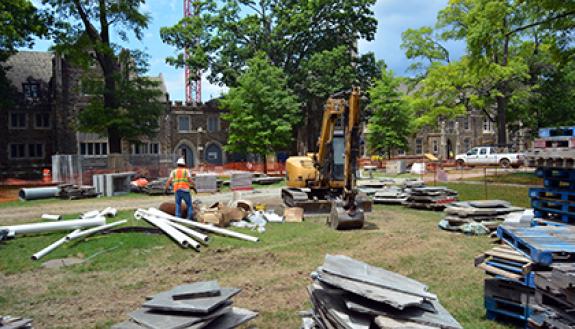 Construction is taking place this summer to remove bluestone sidewalks along the West Campus Quad in order to improve drainage and irrigation before replacing the same stone. Work will occur through August as the first phase of a three-year project. Phot