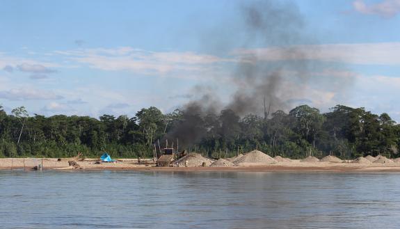 Illegal gold miners use mercury to bind gold particles, then separate the two metals by burning gold-mercury pellets in open fire ovens, releasing clouds of highly toxic mercury particles into the atmosphere. Credit – Melissa Marchese