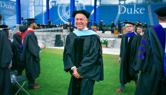 Larry Moneta in regalia leaving Duke’s 2019 Commencement Ceremony