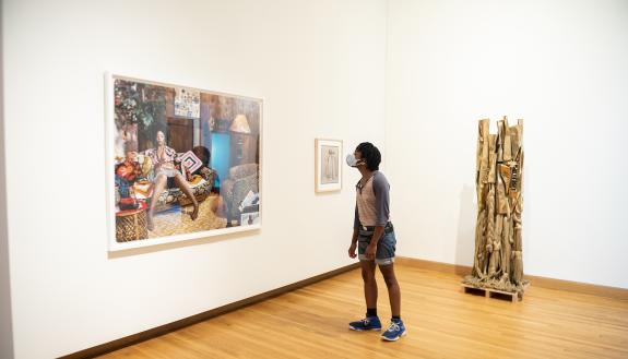 A visitor takes in Lovely Six Footaby Mickalene Thomas. Photo by J Caldwell.