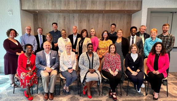 Agroup photo of the Western NC regional cohort on adequate housing in Asheville, May 2022