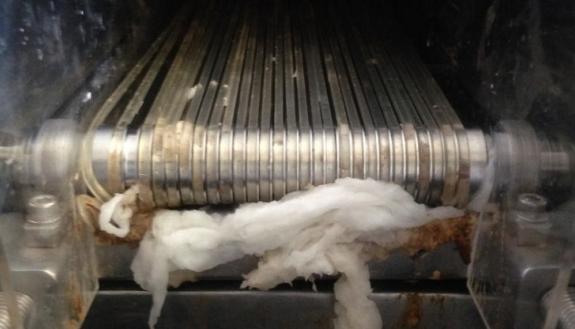 This conveyer of rubber bands separates solid and liquid waste effectively in an experimental sanitation system at a test site in India. But at a facility in South Africa, where the culture uses toilet paper, the results aren’t as good.