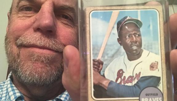 Charlie Thompson with his Hand Aaron baseball card from 1969