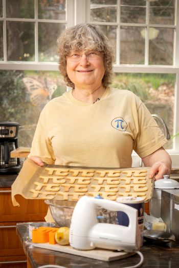 Dr. Ingrid Daubechies, James B. Duke Distinguished Professor of Mathematics and Electrical and Computer Engineering, with her Pi cookies.