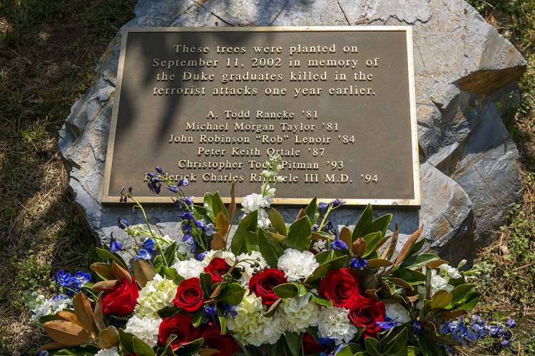 wreath laid at 9/11 plaque on Keohane Quad honoring the six Duke alumni killed on 9/11