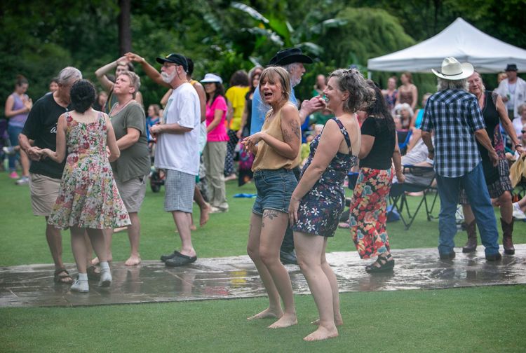 dancing in the rain in Duke Gardens