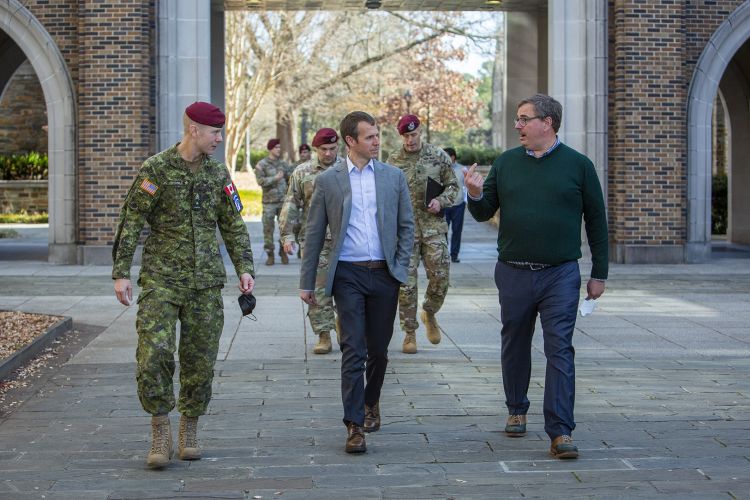 Professor Steve McClelland walks with members from the XVIII Airborne Corps and 82nd Airborne Division during a visit Wednesday to Duke’s Innovation Co-Lab to learn more about the collaboration between Duke Design Defense and Design Health with military s
