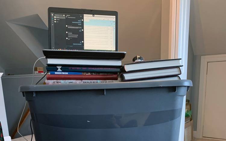 A computer on storage bins.