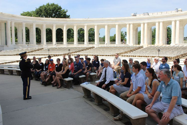 Members at the Duke community gather at the amphitheater at Arlington National Cemetery.