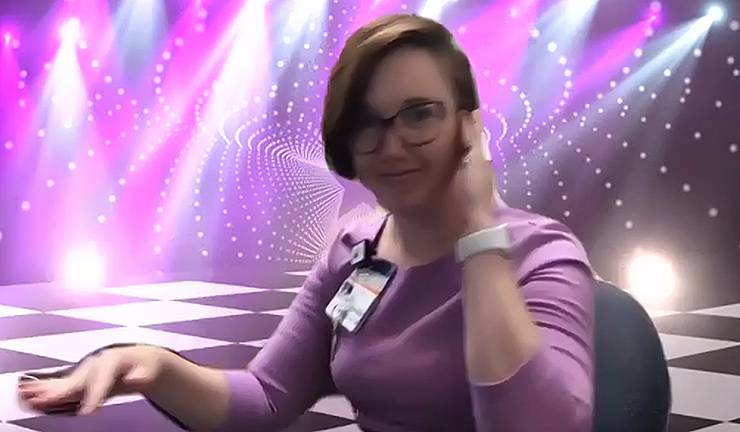 April Dudash puts on a virtual disco background during Cafe DJ Zoom, a virtual dance party she hosts.