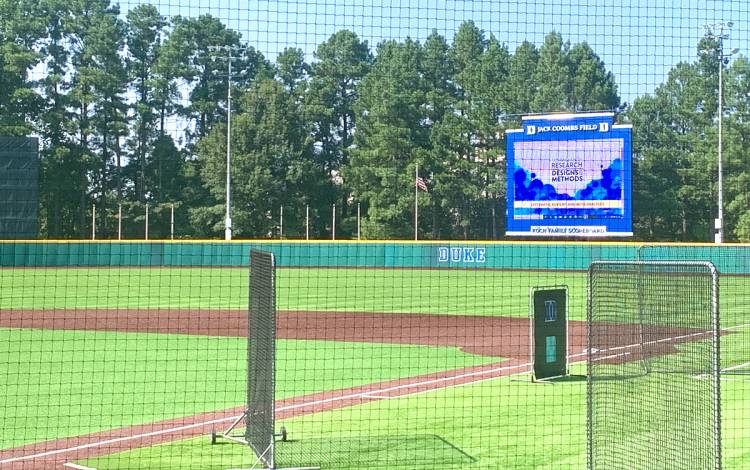 When he taught classes at Jack Coombs Field, Eric Green's slides appeared on the video screen in right field. Photo courtesy of Duke Global Health Institute.
