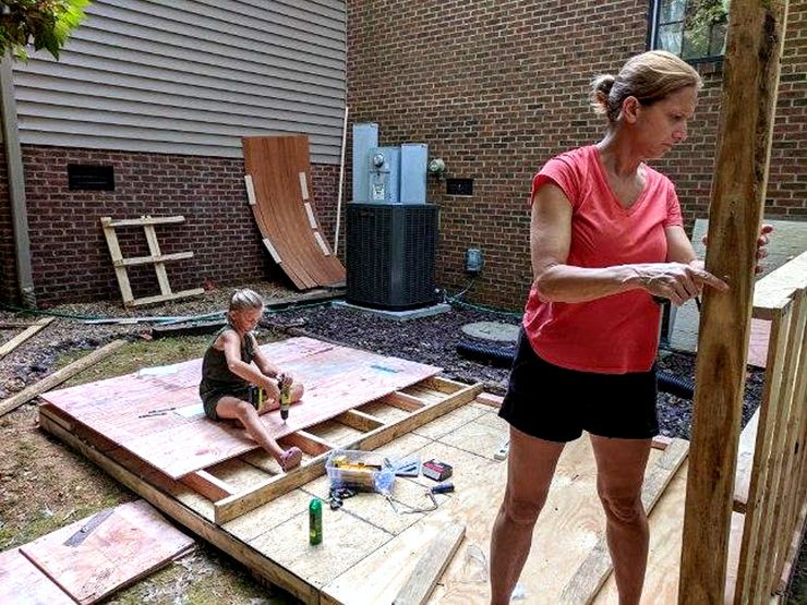 Lindy Norman, right, gets help from her daughter, Ellie, in building a playhouse. Photo courtesy of Lindy Norman.