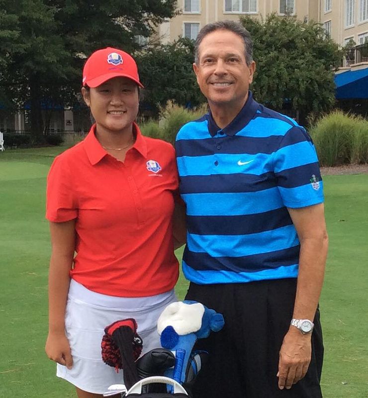 Ed Ibarguen stands with former Duke golfer and current LPGA Tour pro Gina Kim. Photo courtesy of Duke University Golf Club.