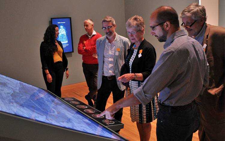 Wired! Lab members examine a previous exhibition they worked on at the Nasher Museum of Art. Photo courtesy of Kristin Huffman.