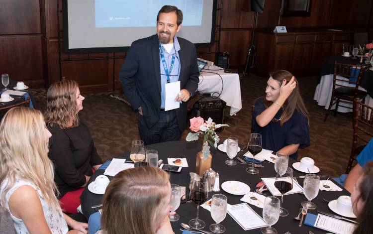 J. Bryan Sexton talks with guests at the Center for Healthcare Safety and Quality' Well-Being Ambassador Forum in 2019.