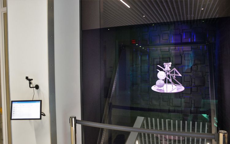 A device in the lobby of the Wilkinson Building showcases student designs with holograms. Photo by Stephen Schramm.