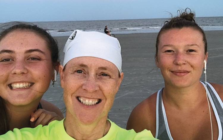 Jameela Nikolich, center, her daughter Katherine, left, and au pair Flora Paul, right, who all lived together at the time, completed a 5K in July 2020. Photo courtesy of Jameela Nikolich.