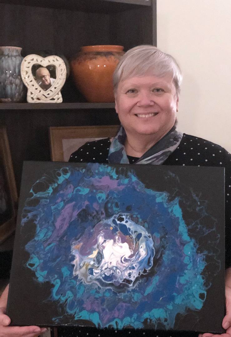 Julie Ramsey made an acrylic pour painting to look like outer space. Photo courtesy of Julie Ramsey.