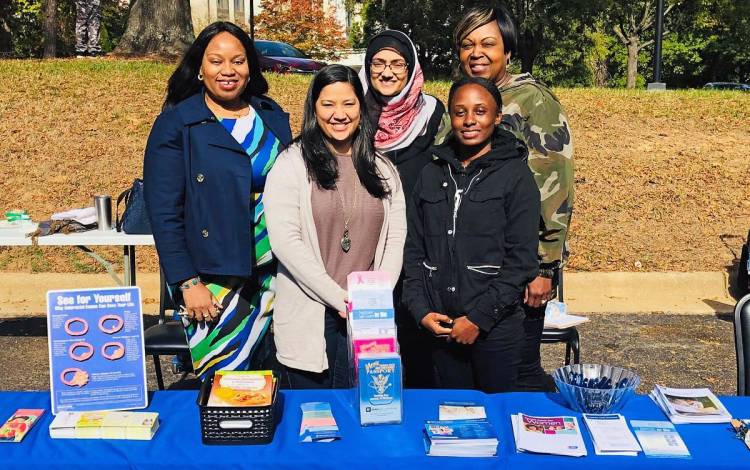 Office of Health Equity staff members provide information at a pre-pandemic Lions Club event in Durham. Photo courtesy of the Office of Health Equity.